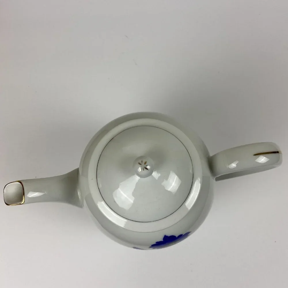 Vintage porcelain large tea pot with the floral decor
